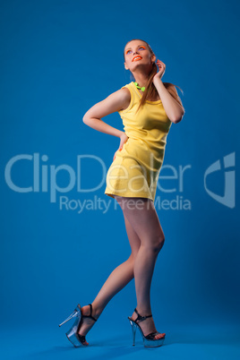 Pretty girl with bright makeup posing in studio