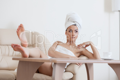 Portrait of sexy young woman posing after shower