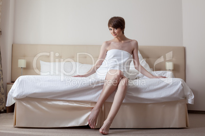 Lovely model with short hair posing in bedroom