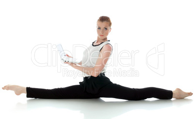 Serious young gymnast posing with laptop