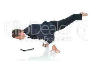 Young busy man posing with laptop in unreal pose