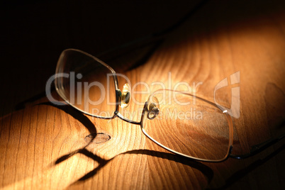 spectacles on wood