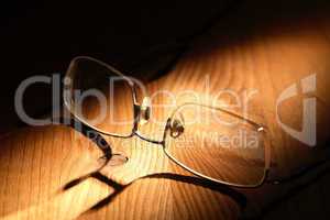 spectacles on wood