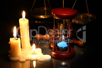 hourglass and candles