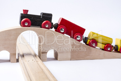 wooden toy train on bridge