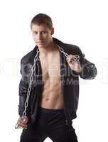 Confident sexy man posing in leather jacket