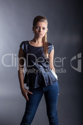 Stylishly dressed model posing in studio