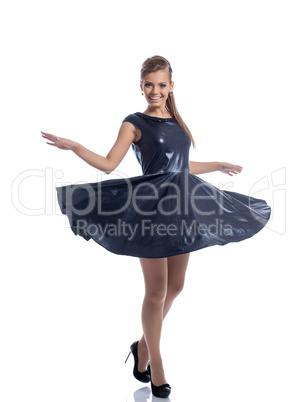 Image of cheerful stylish girl whirls in studio