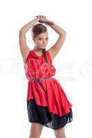 Graceful young girl posing in satin red dress