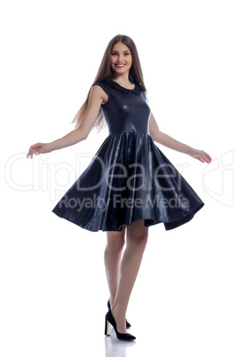 Cute smiling brunette posing in stylish dress