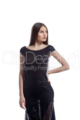 Stylish young woman posing in dress with sequins