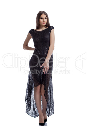 Hot brunette posing in trendy dress with sequins