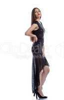 Elegant slim model posing in black cocktail dress
