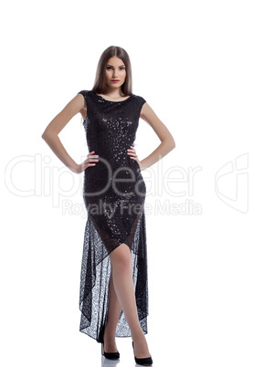 Delightful young woman posing in elegant dress