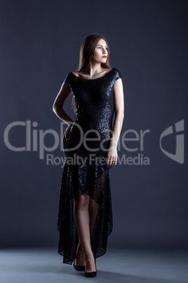 Image of pretty young girl posing in elegant dress