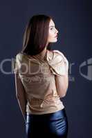 Profile of sensual young woman posing in studio