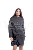 Beautiful brunette posing in gray woolen coat