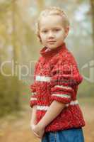 Image of pretty little girl posing in red sweater