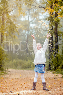 Image of enthusiastic little girl playing in park