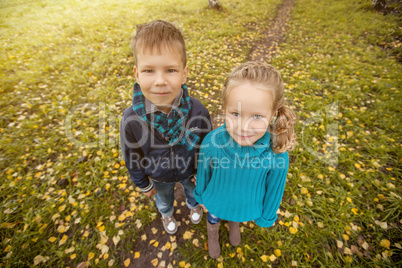 Image of pretty twins posing in stylish clothes