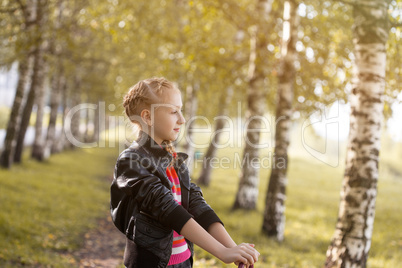 Image of adorable girl posing in birch grove