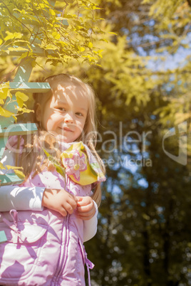 Smiling cute girl posing looking at camera