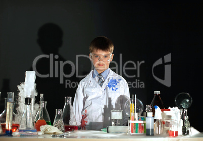 Cute little boy posing as scientist in lab
