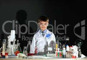 Cute little boy posing as scientist in lab