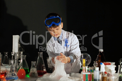 Image of little scientist watching experiment