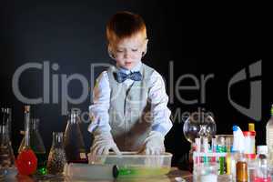 Young physicist experimenting with the reagents