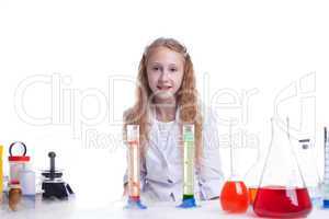 Smiling little experimenter looking at camera