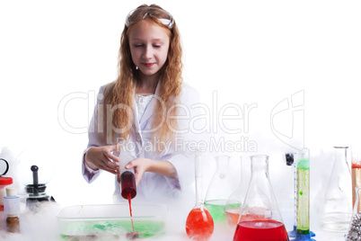Curious schoolgirl mixes reagents in studio