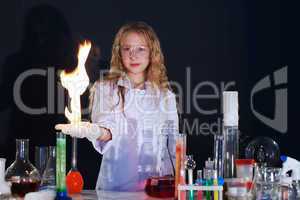 Curly girl shows science experiment in studio