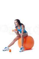 Image of smiling fitness woman exercising on ball