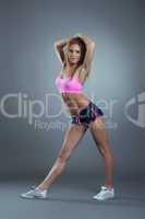 Studio shot of beautiful muscular sportswoman