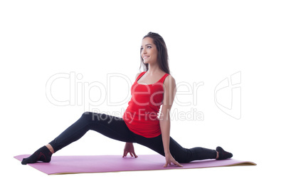 Smiling brunette posing on gymnastic mat
