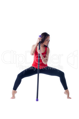 Sensual young woman posing with fitness bar