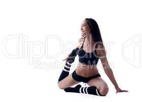 Image of cute model doing stretching in studio