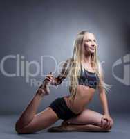 Cute long-haired blonde doing stretching