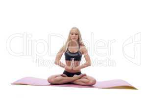 Sensual young girl meditates in lotus position
