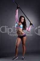 Image of sexy muscular sportswoman holding fitbar