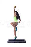 Happy sporty brunette doing aerobic exercise