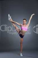 Charming flexible athlete doing vertical split