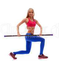 Strong cute blonde exercising with fitbar