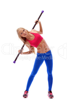 Flexible young female athlete posing with fitbar