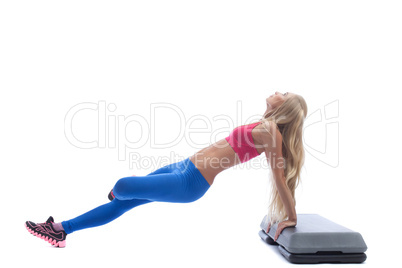 Beautiful slim blonde doing aerobics exercises