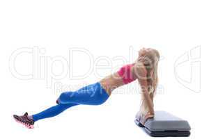 Beautiful slim blonde doing aerobics exercises