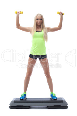 Cute strong blonde doing aerobics on stepper