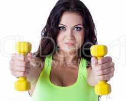 Portrait of smiling sporty woman with dumbbells