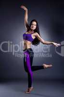 Graceful athletic dancer posing in studio